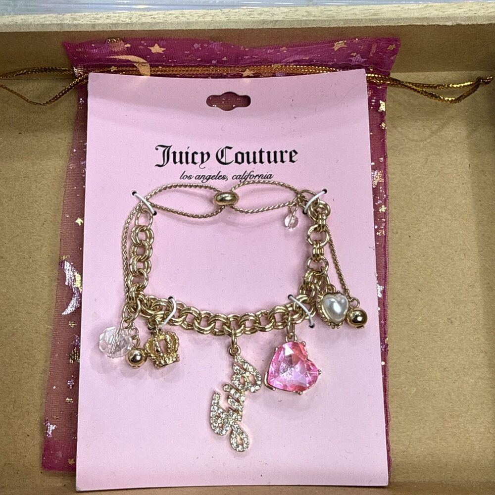 (Z4) Gold Juicy Couture bracelet with 5 pink heart charms, and rhinestone logo